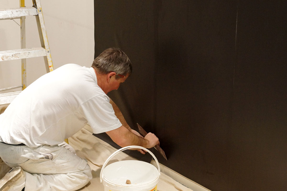 MagLiner being hung using MagFix Adhesive